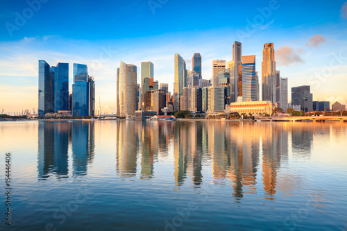 Singapore city skyline at the Marina bay during sunrise photo