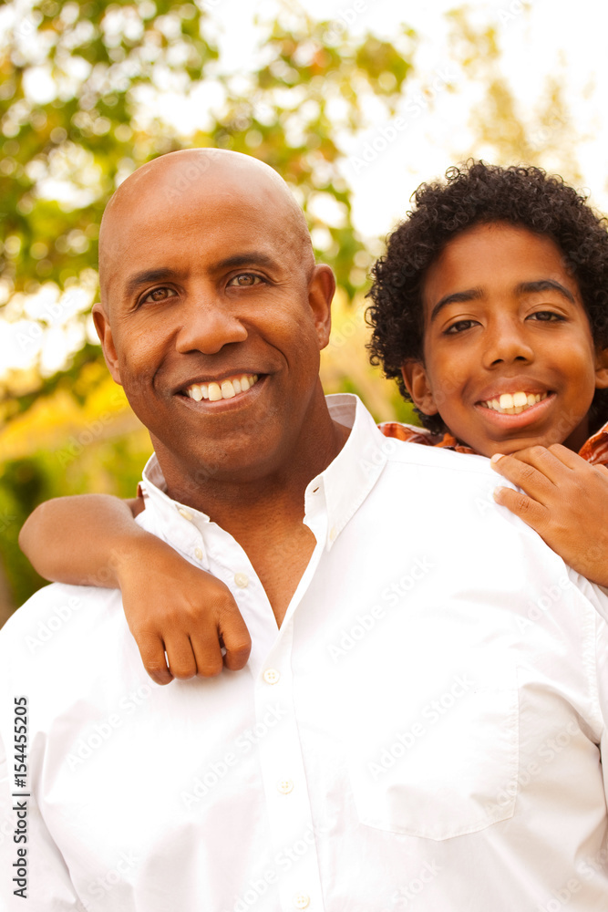 Fototapeta premium African American father and son talking and laughing.