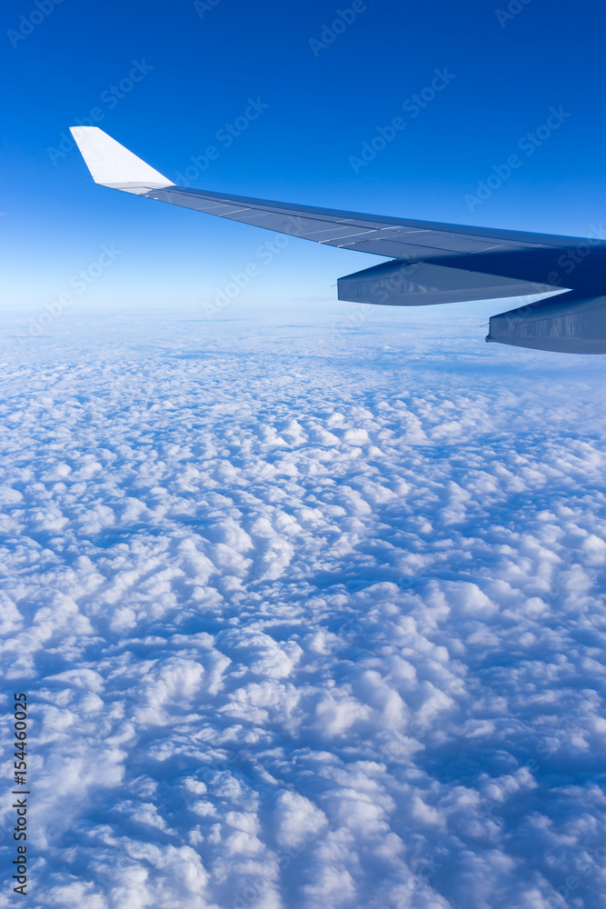 beautiful cloudy sky and airplane wing sky on sunny day, aerial view from airplane window, filter effect beautiful cloudy sky and airplane wing sky on sunny day, aerial view from airplane window, filter effect