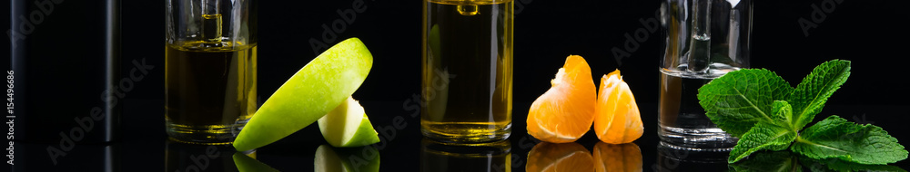 Black background with a set of fruit flavors with reflection in the surface
