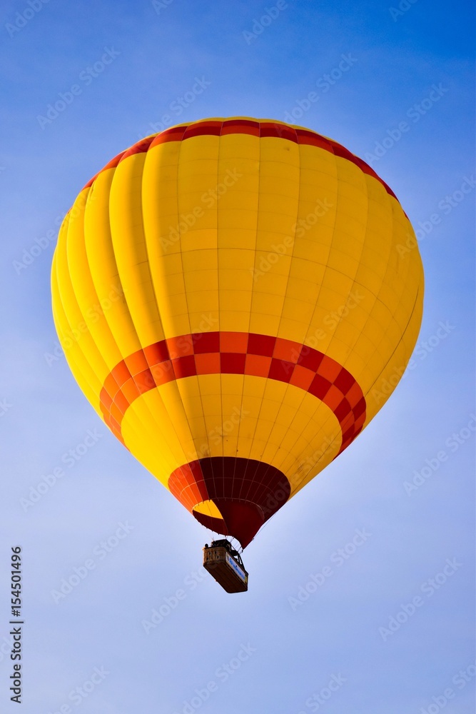Hot air balloon flying over spectacular Cappadocia Hot air balloon flying over spectacular Cappadocia