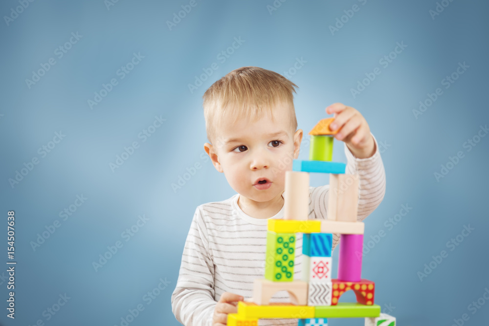 Portrait of a two years old child sitting at the table Portrait of a two years old child sitting at the table