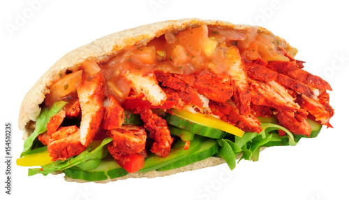 Tandoori chicken and salad pitta bread sandwich isolated on a white background