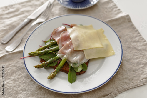 Sandwich with ham, cheese, and asparagus