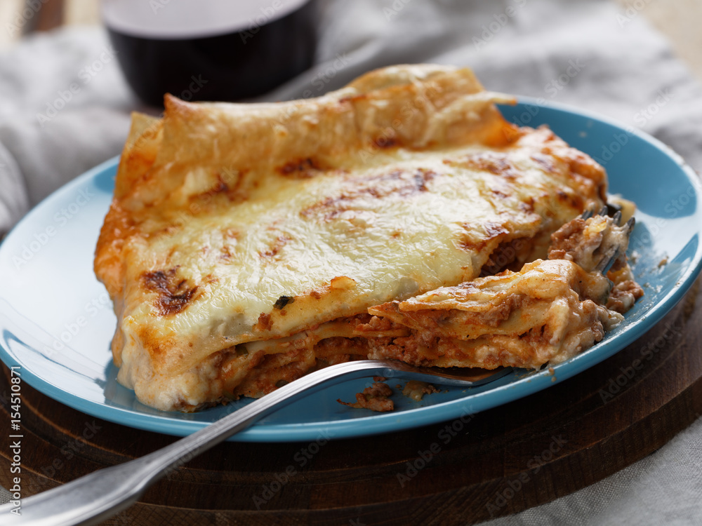Lasagna Bolognese on a rustic table
