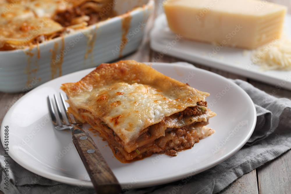 Lasagna Bolognese on a rustic table