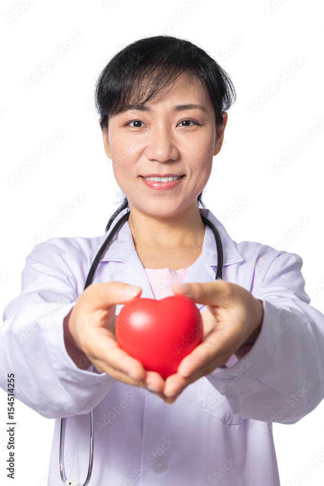 Asian female doctor holding red heart with stethoscope Asian female doctor holding red heart with stethoscope