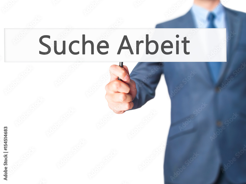 Suche Arbeit (Job Search in German) - Businessman hand holding sign Suche Arbeit (Job Search in German) - Businessman hand holding sign