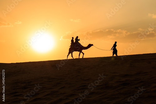camel ride during sunset 