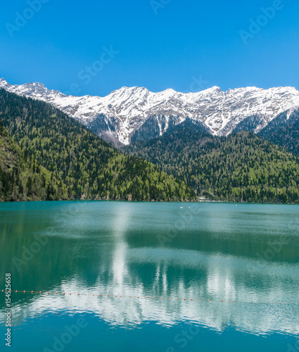 Fototapeta Naklejka Na Ścianę i Meble -   A landscape with  beautiful  mountain  Lake  Ritsa,Abkhazia, Caucasus, in spring