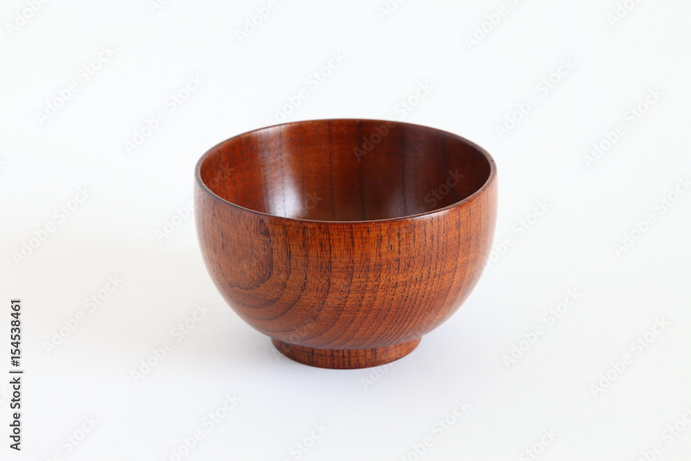 Wooden bowl (owan) isolated on white with natural shadows Wooden bowl (owan) isolated on white with natural shadows
