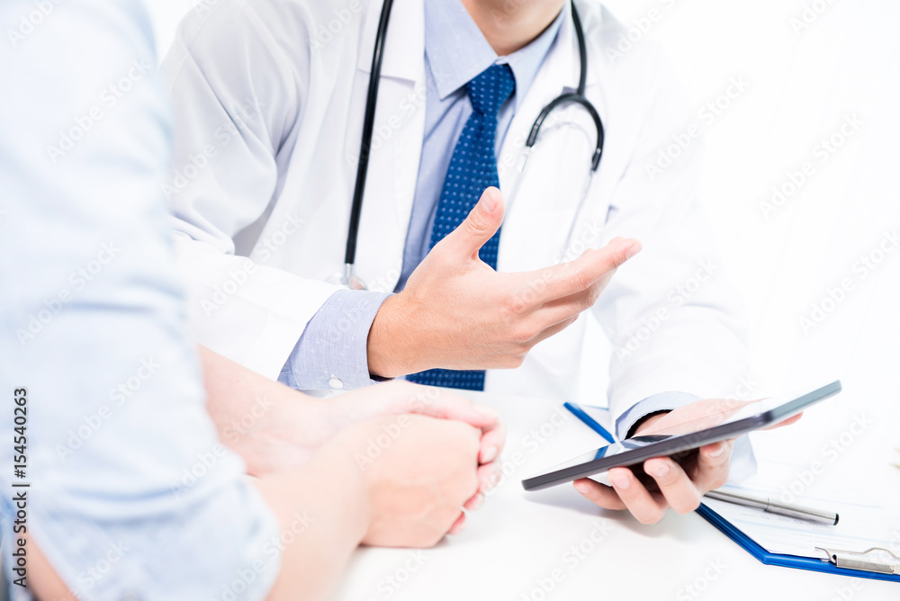 Doctor talking and explaining treatment to patient Doctor talking and explaining treatment to patient