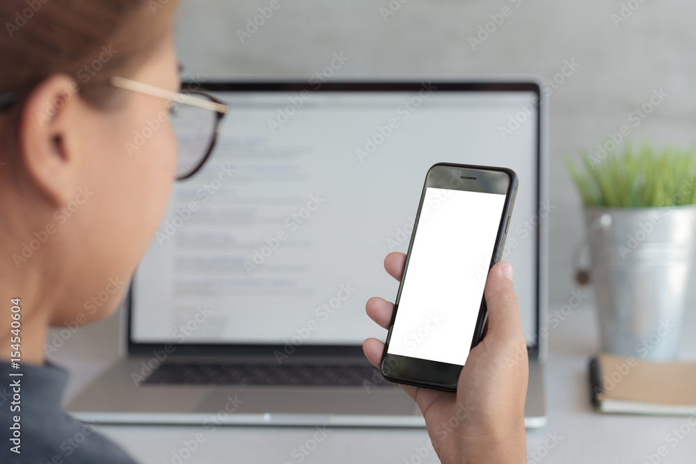 close-up woman holding phone and looking blank screen in office workplace