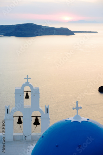 Detail of Agios Theodori church dome and belltower at sunset, Firostefani, Santorini, Greece photo