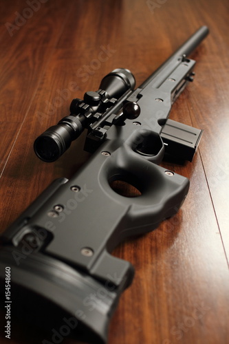 Sniper rifle on the wood floor