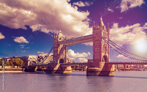 Tower Bridge in London, UK. The bridge is one of the most famous landmarks in Great Britain, England. Picture in a dreamy purple look with sunset feeling.