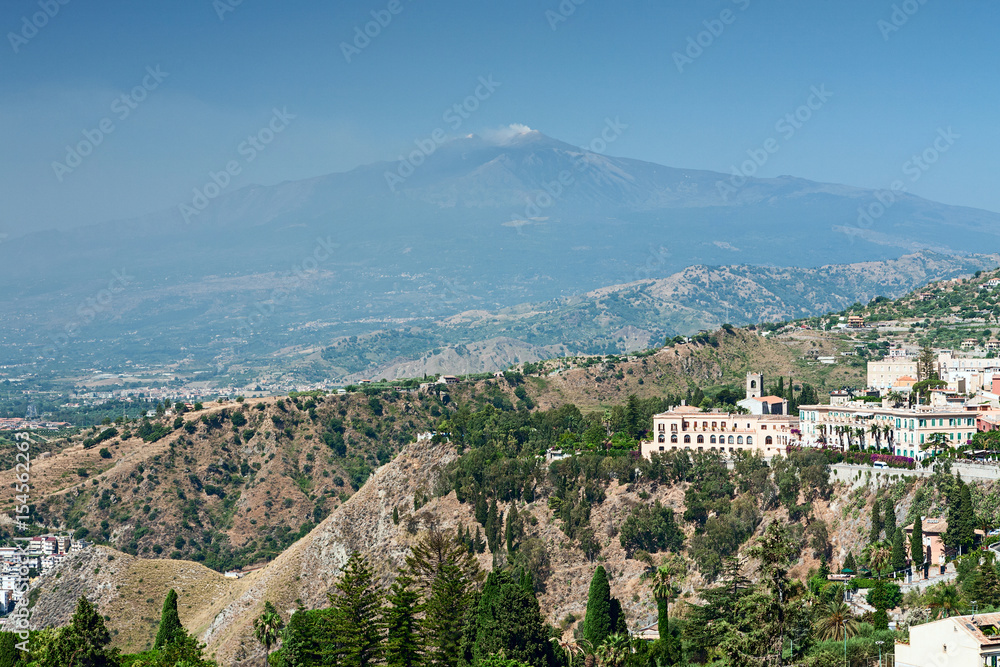 View of a part of Taormina city and the Etna volcano, Sicily, Italy