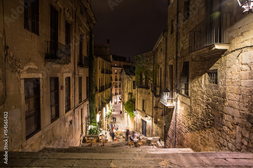 Girona street view with cafe in old town in the night