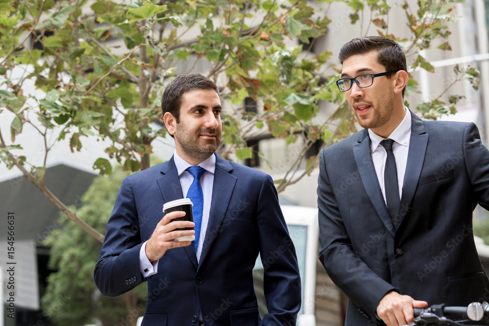 Two businessmen talking outdoors Two businessmen talking outdoors