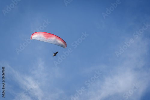 Paraglider in the blue sky