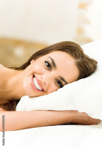 Happy woman waking up at home