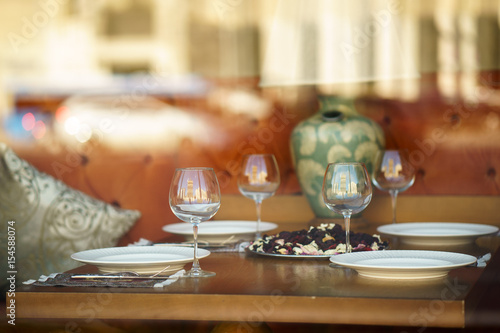 table for event with flower vases towels and wine glasses