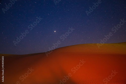 Barkhan dune  starry night in the desert of Kazakhstan