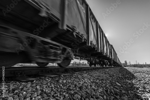Freight train passing by. Nature landscape. Blurry / fast moving.