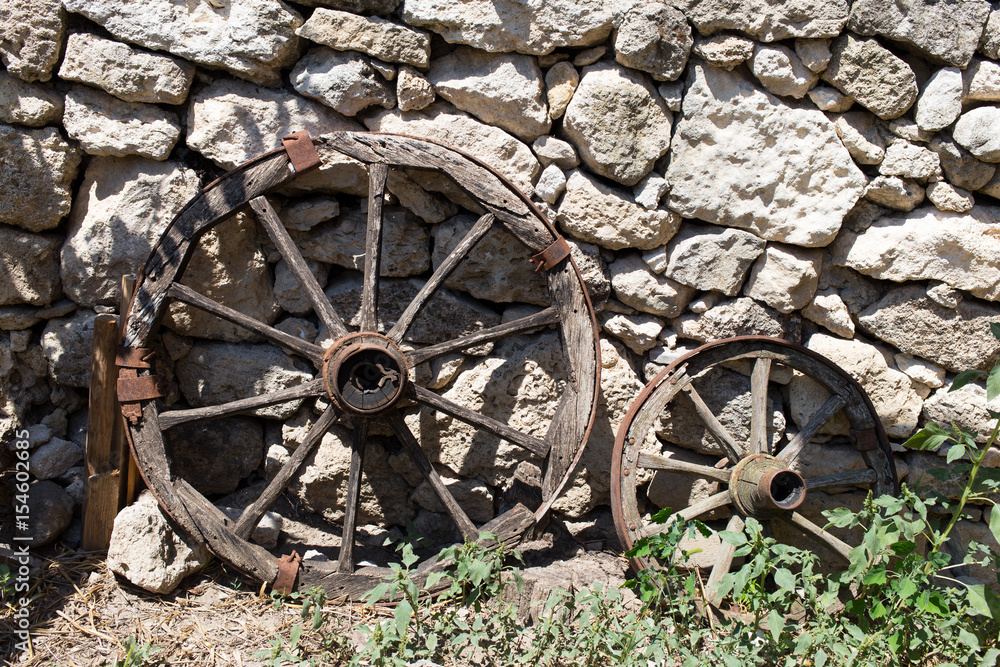 Old cart wooden wheels.