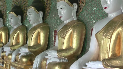 Sagaing, inside the U Min Thonze Cave, Buddha statues in a row photo