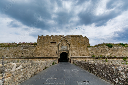 Gate of Saint John, bridge leading to it and moat at Rhodes old town, Greece