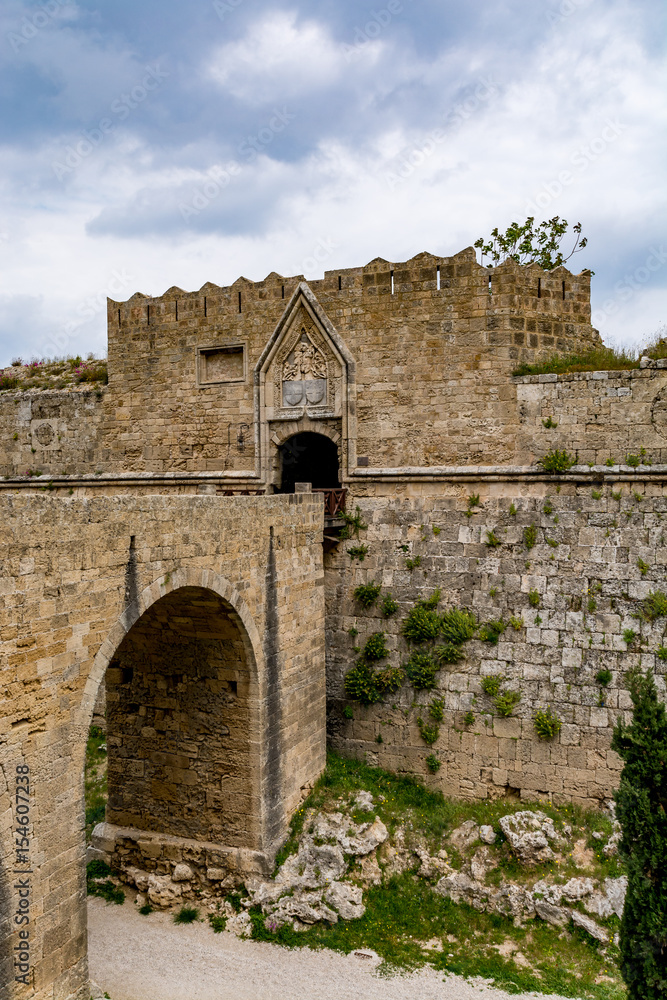 Gate of Saint John, bridge leading to it and moat at Rhodes old town, Greece