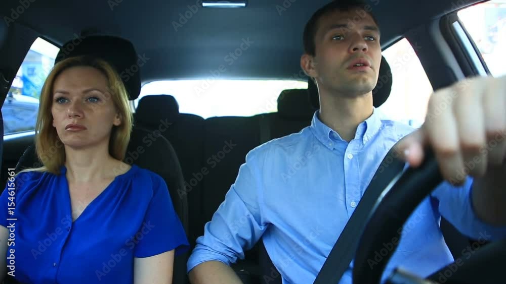 Couple driving in the car, a man and a woman ride together in the car ...