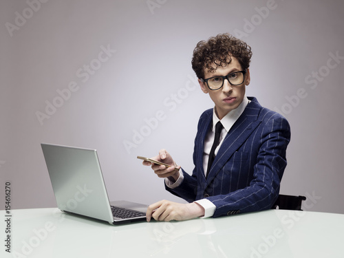 Bilde på lerret Funny businessman with laptop