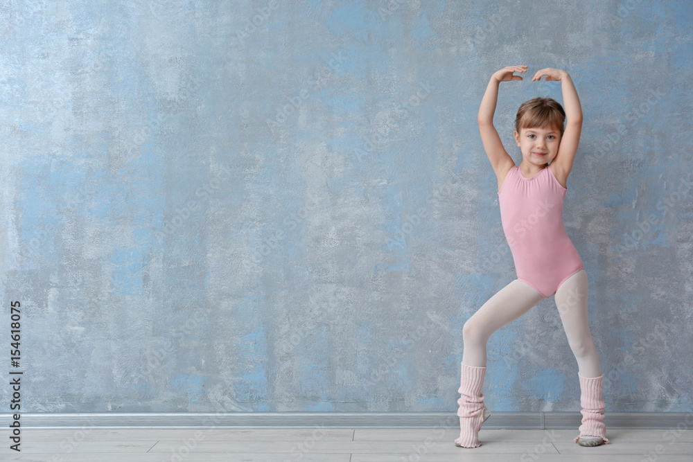 Fototapeta premium Cute little ballerina in dance studio
