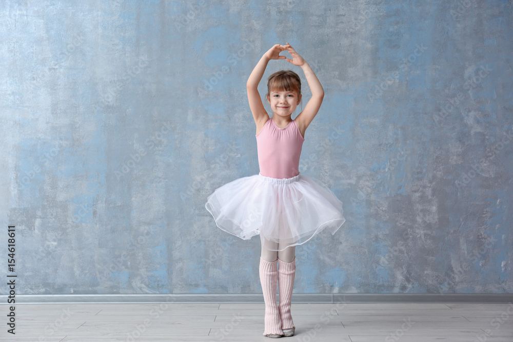 Obraz premium Cute little ballerina in dance studio