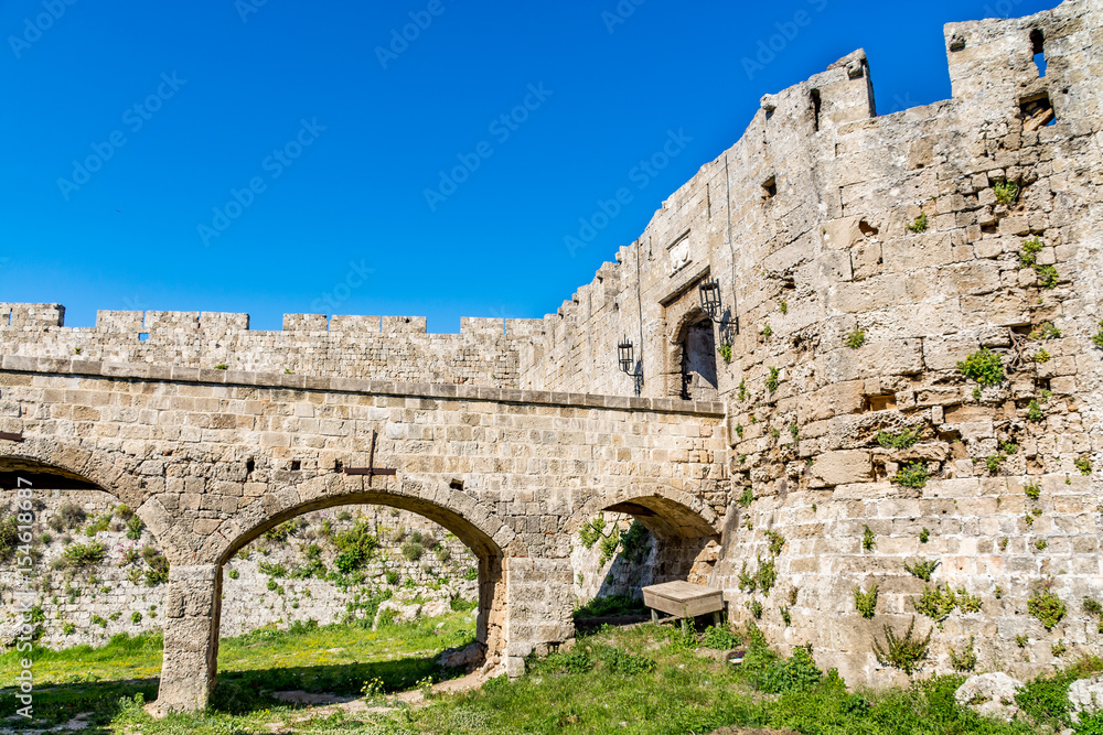 Gate of Saint John, bridge leading to it and moat at Rhodes old town, Rhodes island, Greece