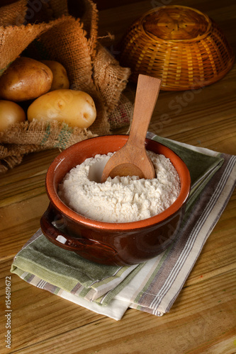 potato starch in terracotta bowl photo