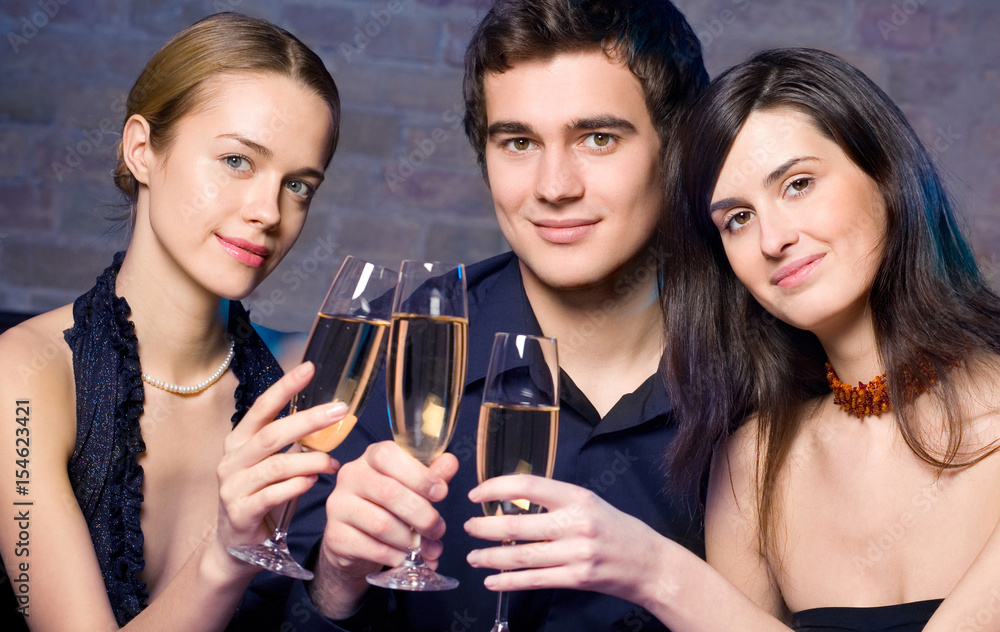 Young happy people with champagne at party Young happy people with champagne at party