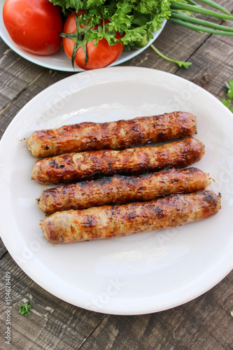 Grilled sausages on the coals