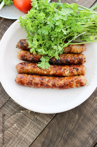 Grilled sausages on the coals