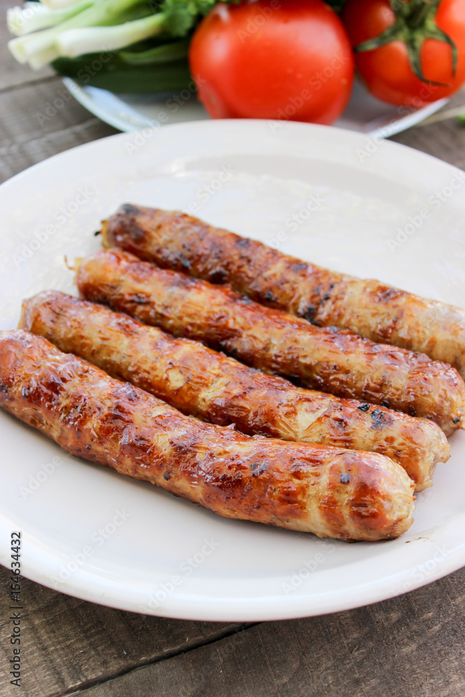Grilled sausages on the coals Grilled sausages on the coals