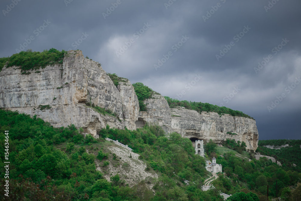 beautiful wild nature, the green trees, woods, high cliffs, caves, houses and castles, rain clouds summer beautiful wild nature, the green trees, woods, high cliffs, caves, houses and castles, rain clouds summer