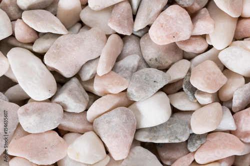 Sea pebbles: light gray, dark gray, beige, pink. photo