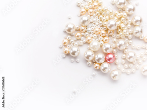 Pile of colorful pearl on white background © Prostock-studio