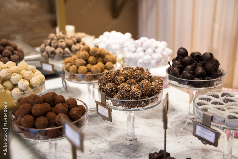 Selection of chocolate in a row, shop in Belgium Selection of chocolate in a row, shop in Belgium
