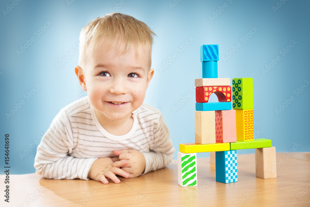 Portrait of a two years old child sitting at the table Portrait of a two years old child sitting at the table