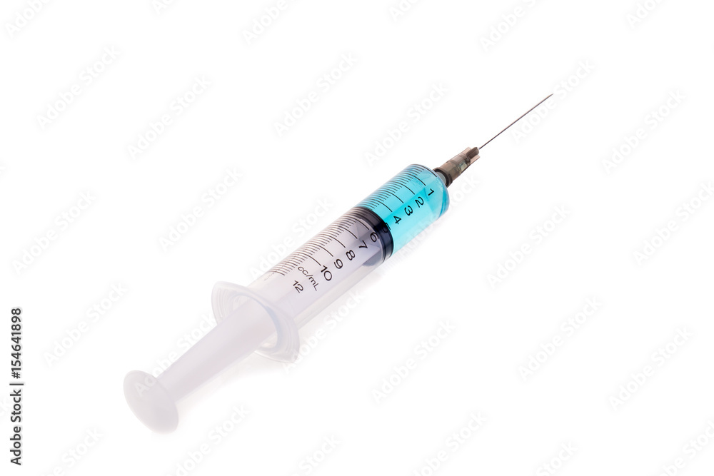 pills and plastic medical syringe on a white background pills and plastic medical syringe on a white background