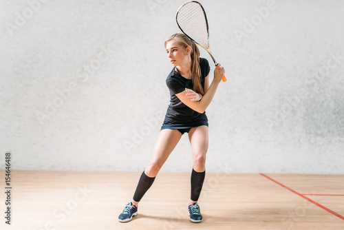 Squash game training, female player with racket © Nomad_Soul