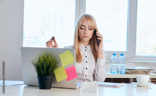 beautiful business woman in the office at the desk